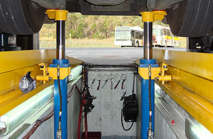 Hartex pit jacking system showing truck in elevated position