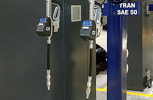 Lubrication dispensers installed in truck workshop with above ground gantry
